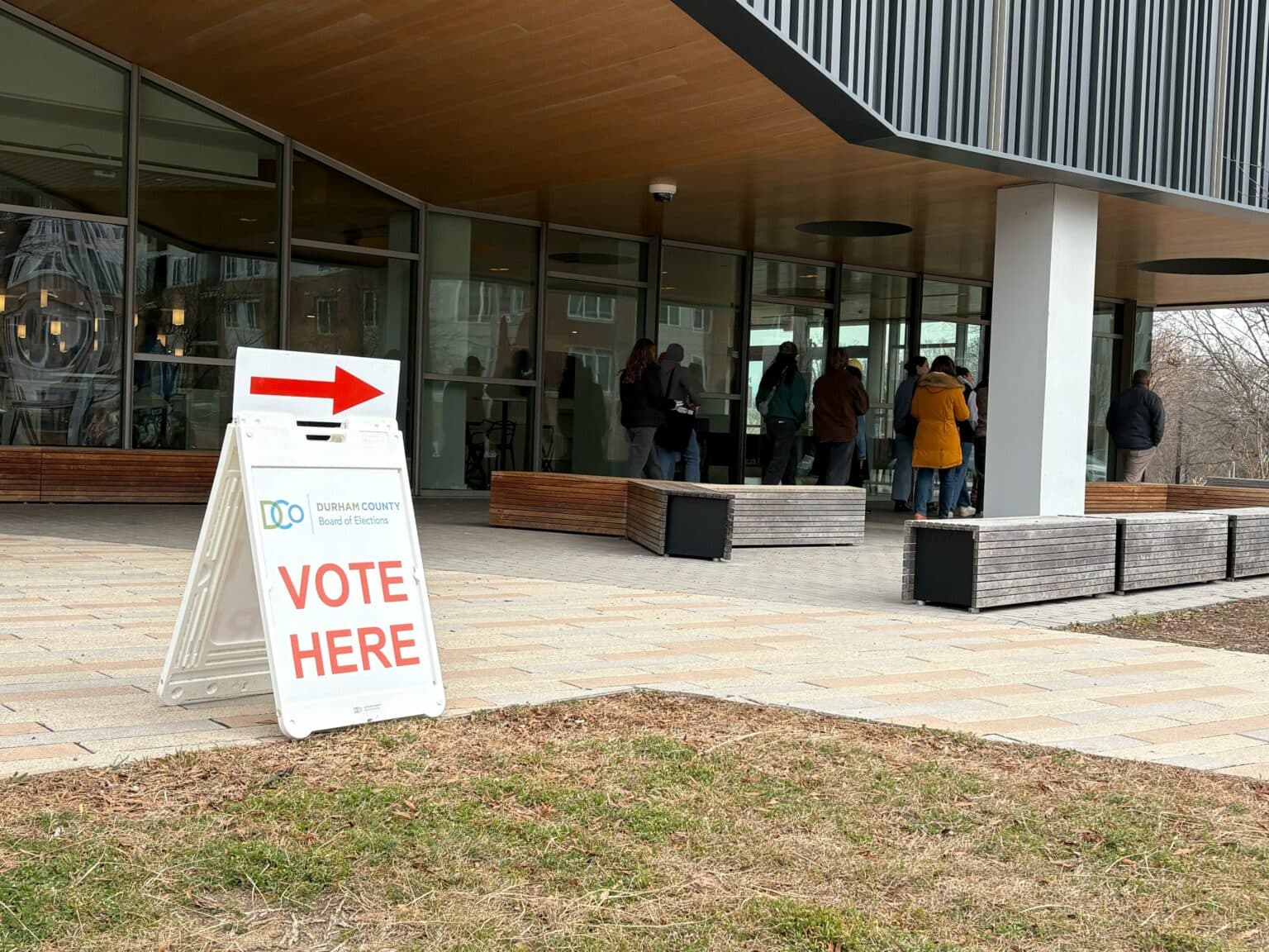 A voting sign stands outside the Durham County Main Library.