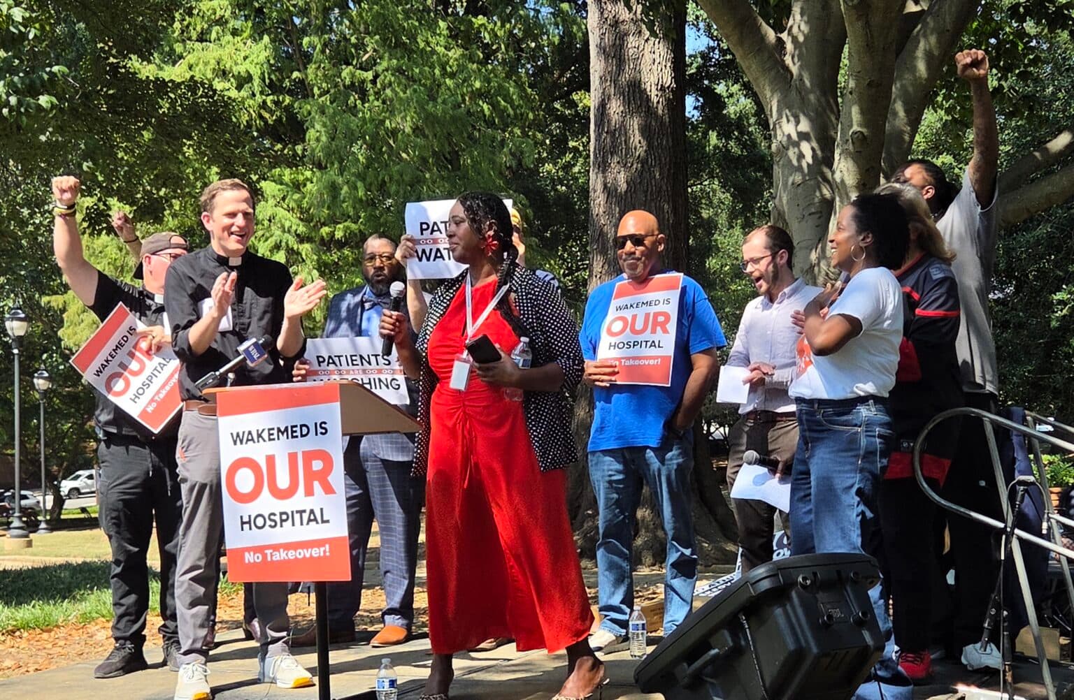 WakeMed supporters gather at a rally in Raleigh’s Nash Square.