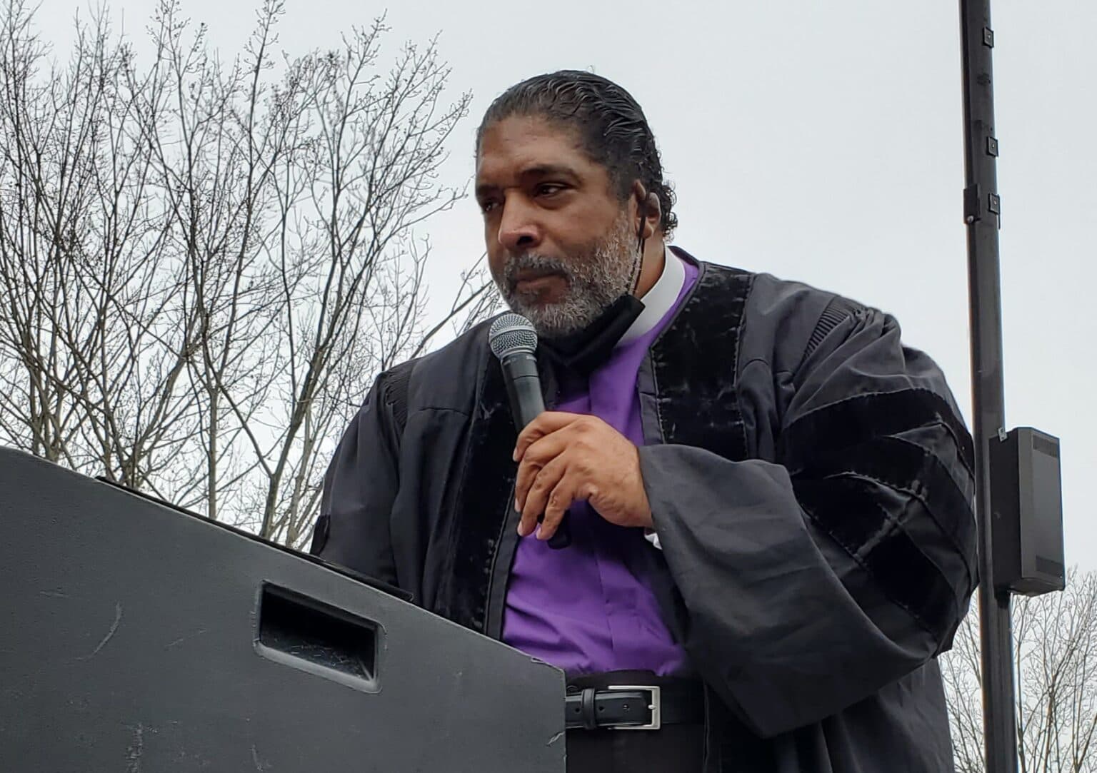 Bishop William Barber speaks at a podium.